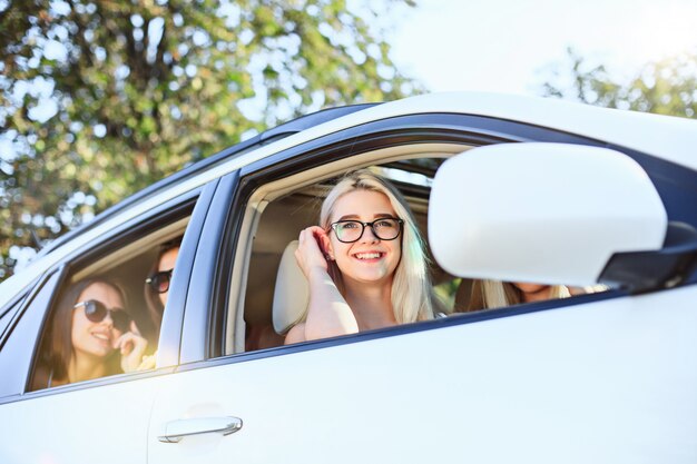 The young women in the car smiling