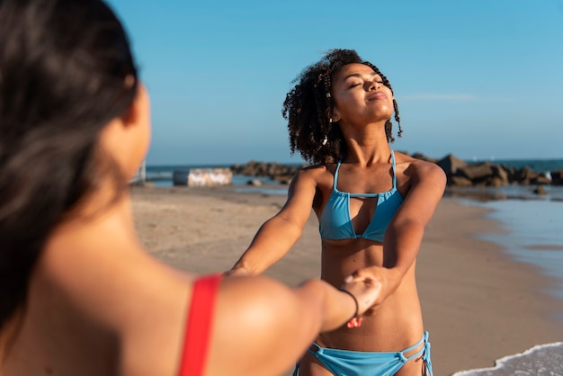 Young women having fun at the beach