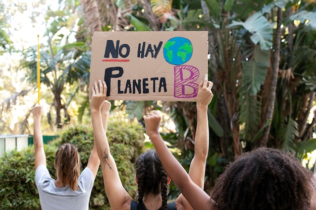 Free photo young women protesting against climate change