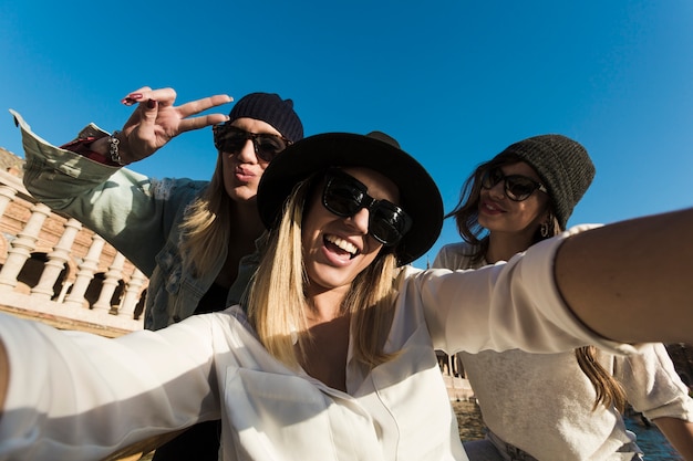 Free photo young women taking selfie during trip