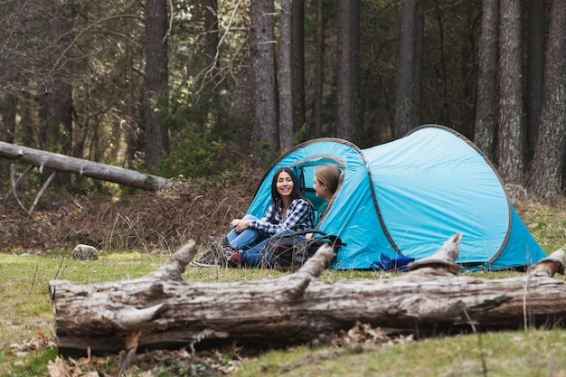 Free Photo young women talking in the tent