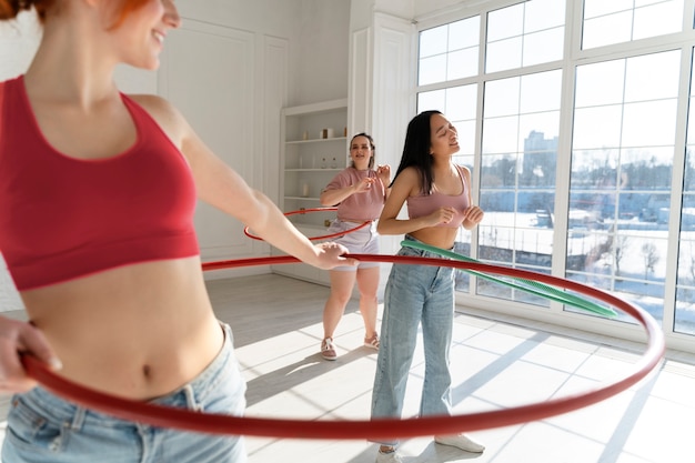 Young women with hula hoops