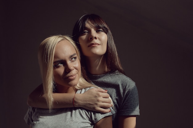 Young women with shirt on wall