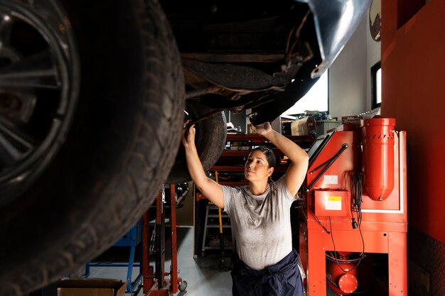 Young worker in a car workshop