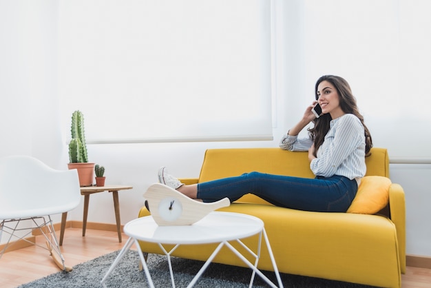 Young worker resting and talking on the phone