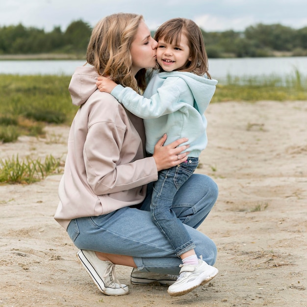 Free Photo youngster outdoors and mommy