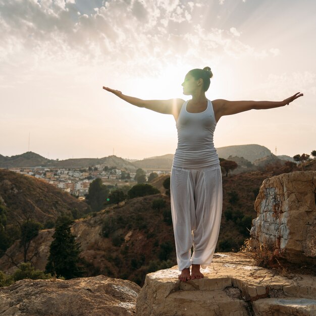 Youngwoman, yoga, nature and sunset