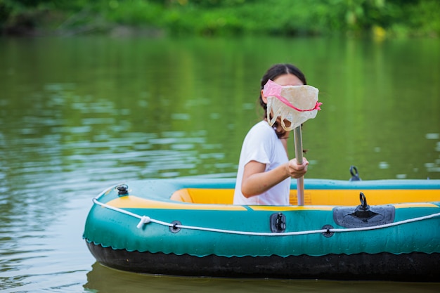 Free Photo youth collect garbage in the river, concept of national youth day and world environment day.