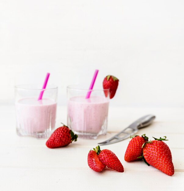 Yummy strawberry milkshake and straws