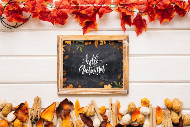 Free PSD autumn mockup with slate in between leaves