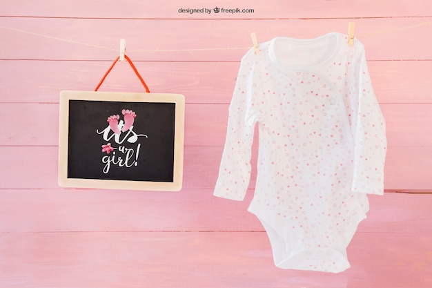 Free PSD baby mockup with clothes peg