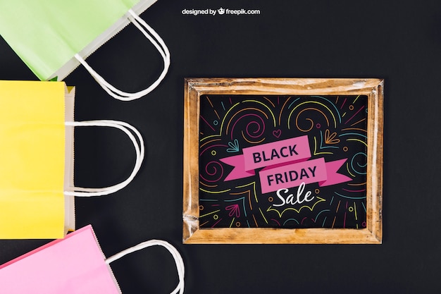 Black friday mockup with slate and bags