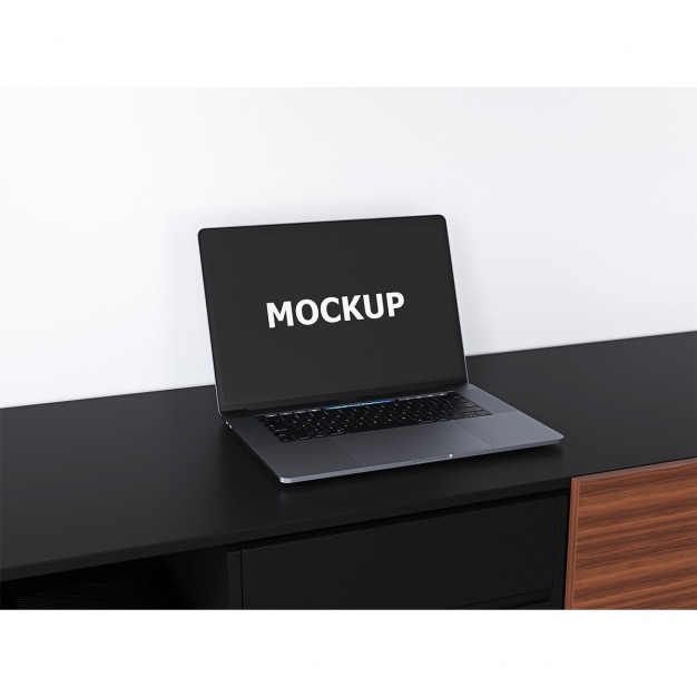 Free PSD black laptop mockup on a desk