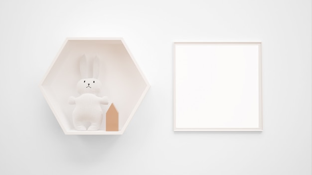 Blank photo frame mockup hanging on the wall next to a bunny toy