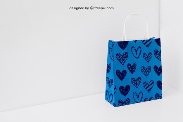 Free PSD blue paper bag in corner