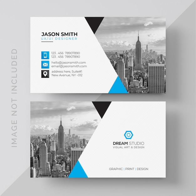 Blue and white business card with photo of city