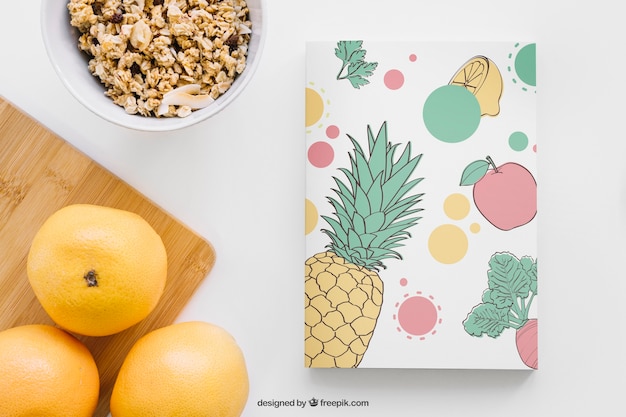 Free PSD book cover mockup with grapefruits