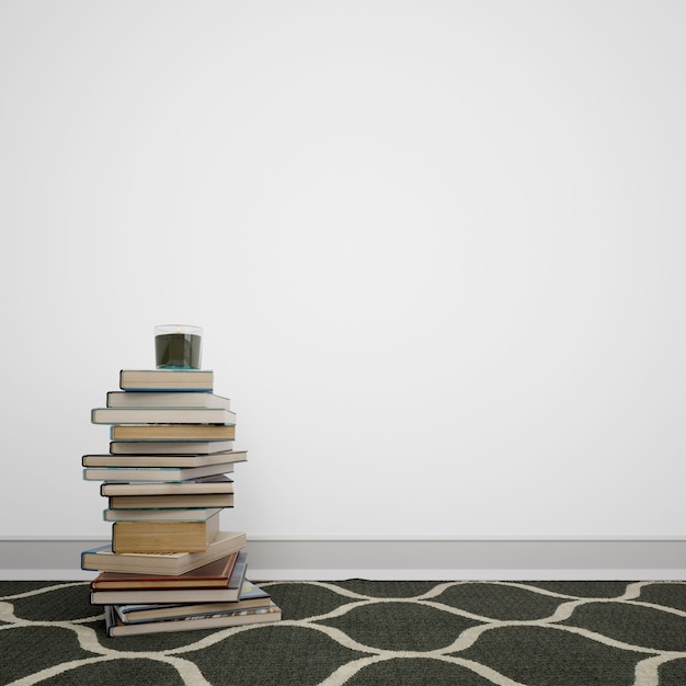 Free PSD books stacked on the floor next to the white wall with copyspace