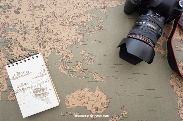 Free PSD camera and notepad on world map