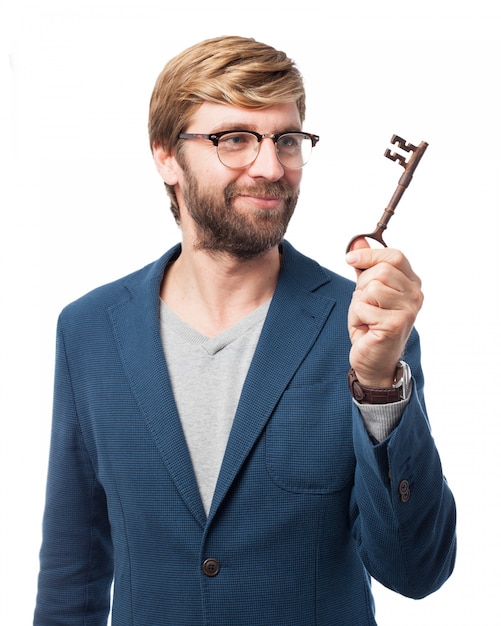 Free PSD cheerful businessman holding an old key