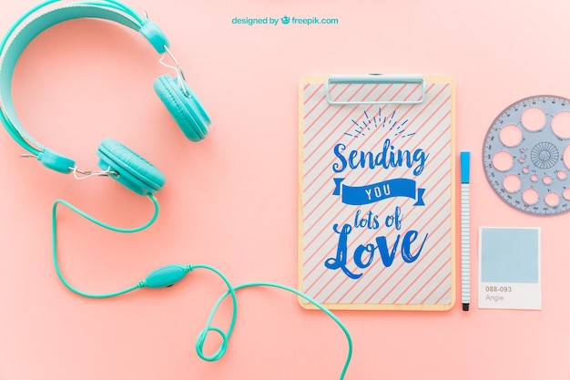 Free PSD clipboard with headphones and instant photo