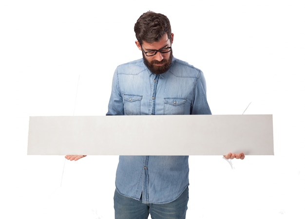 Free PSD concentrated boy holding an empty sign