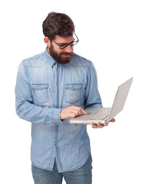 Concentrated teen with his laptop