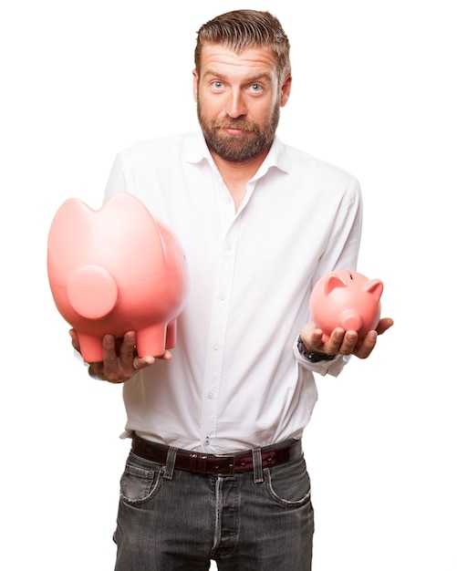 Confused employee showing two piggy banks