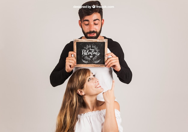 Couple presenting slate