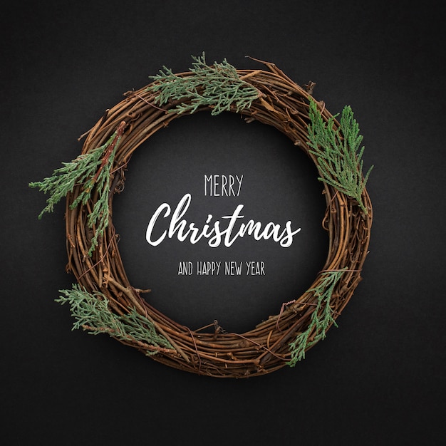 Free PSD cute christmas wreath on blackwith christmas tree leaves