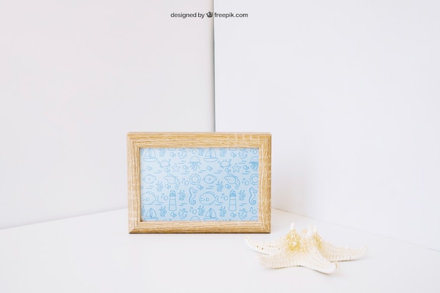 Free PSD decorative photo frame mockup with starfish