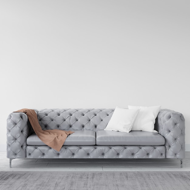 Empty wall with elegant sofa