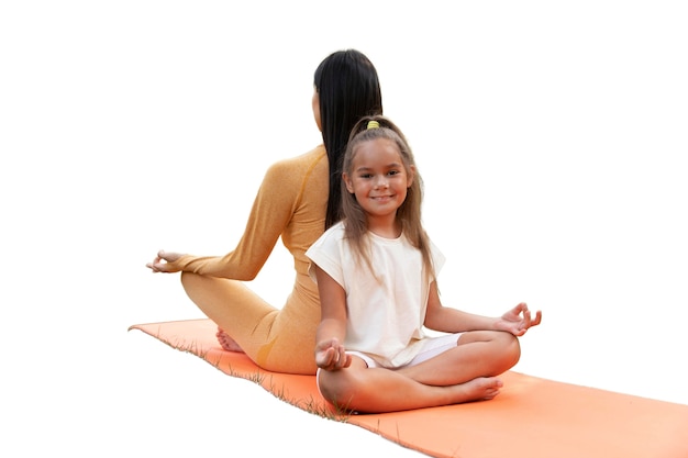 Free PSD female yoga instructor doing meditation with young girl