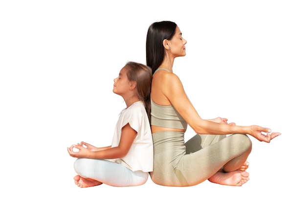 Free PSD female yoga instructor doing meditation with young girl