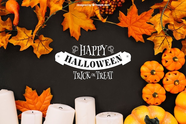 Free PSD halloween mockup with autumn leaves and candles