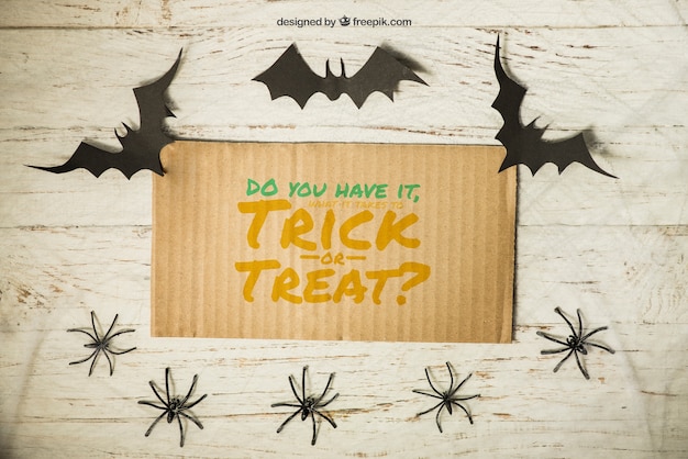 Free PSD halloween mockup with cardboard and bats