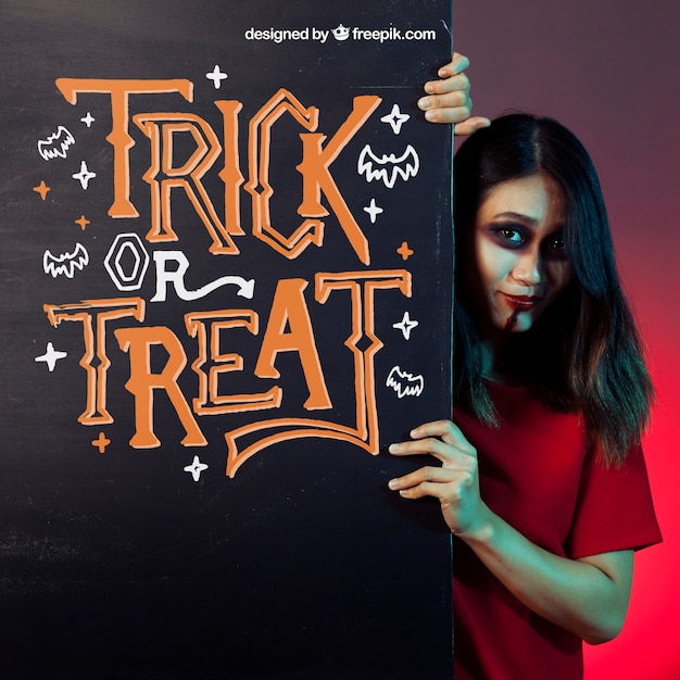 Free PSD halloween mockup with girl behind black wall