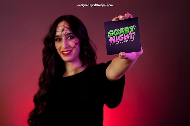 Free PSD halloween mockup with girl presenting card