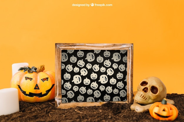 Free PSD halloween mockup with slate and pumpkin decoration