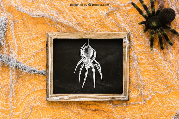 Free PSD halloween slate mockup on cobweb