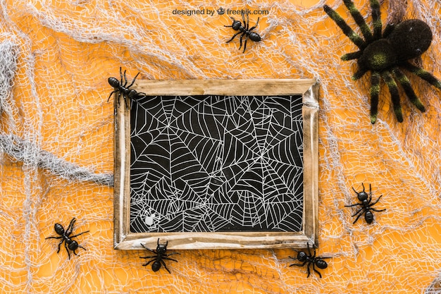 Free PSD halloween slate mockup with ants and spider