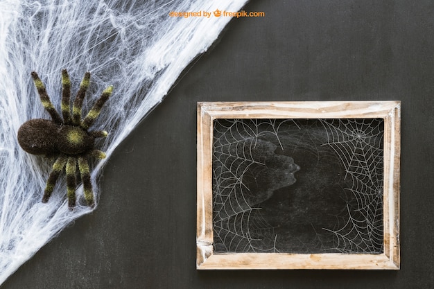 Free PSD halloween slate mockup with cobweb and spider