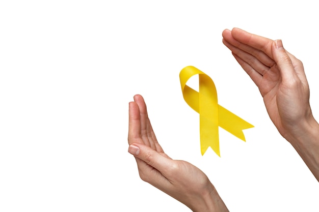 Free PSD hand with yellow ribbon