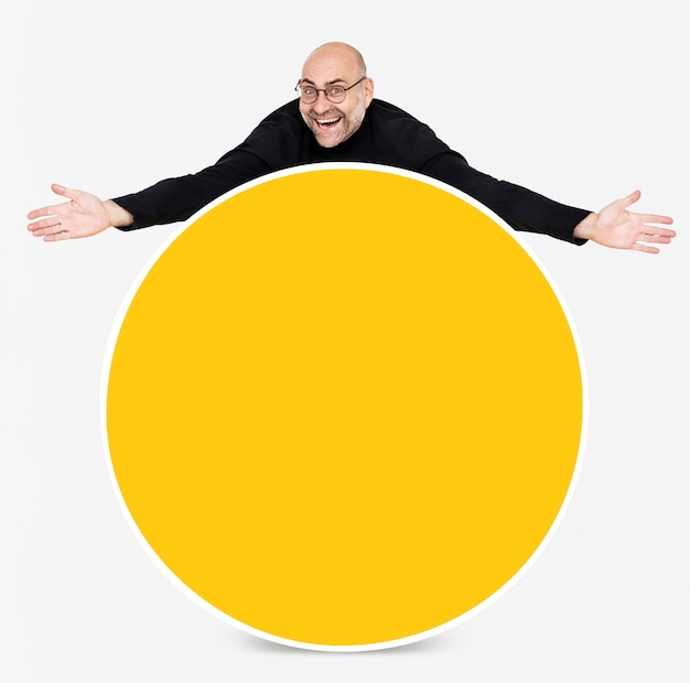 Free PSD happy man showing a round yellow board