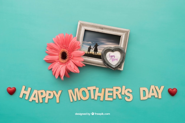 Happy mothers day lettering and photo frame with flower