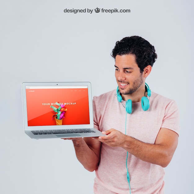 Free PSD happy young guy with laptop's template