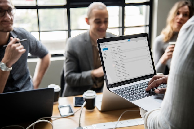 Free PSD man checking his email on a laptop