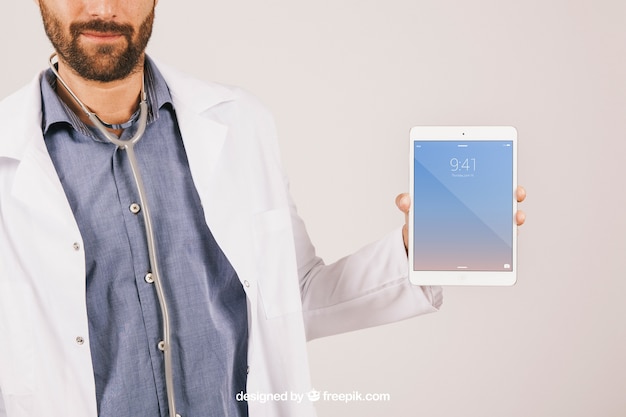 Free PSD mock up with doctor, stethoscope and tablet