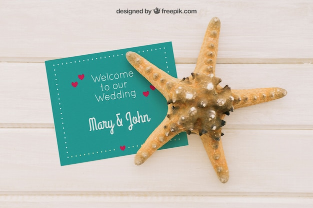 Mock up with wedding invitation and starfish