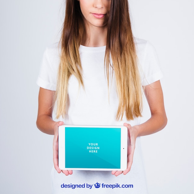 Free PSD mockup concept of woman showing tablet